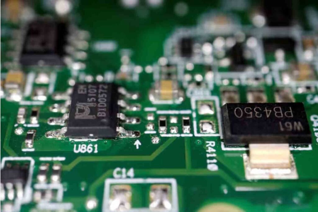 Semiconductor chips are seen on a printed circuit board in this illustration picture.