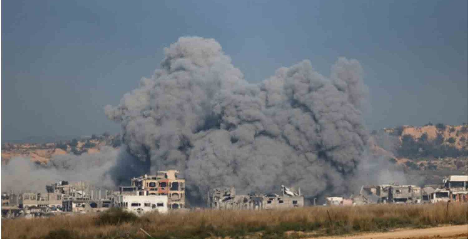 Smoke rises after an explosion in northern Gaza, before a ceasefire deal between Israel and Hamas goes into effect, as seen from Israel.