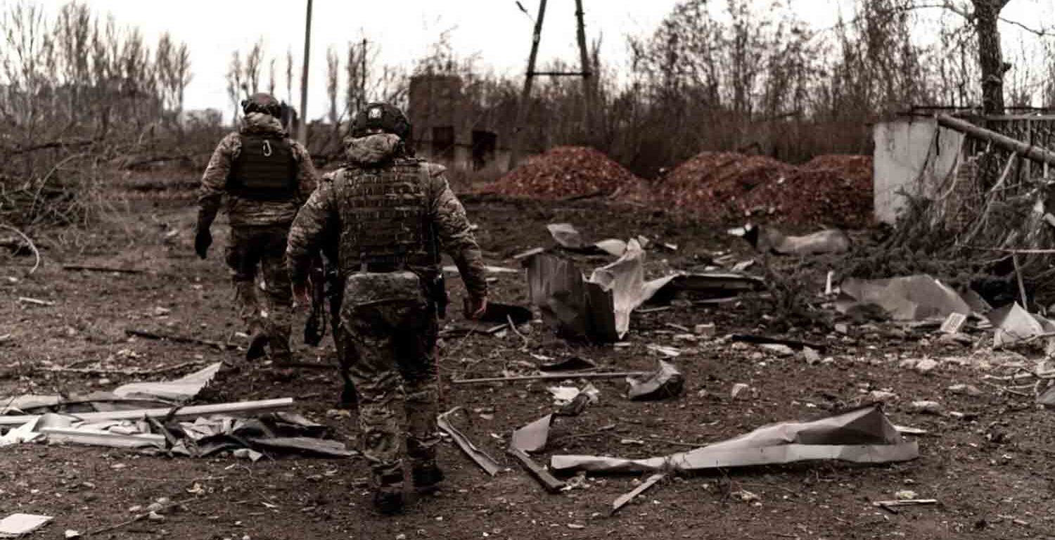 Soldiers walk among debris as civilians evacuate Pokrovsk in eastern Ukraine.