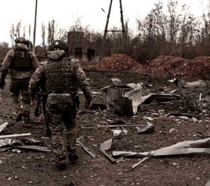 Soldiers walk among debris as civilians evacuate Pokrovsk in eastern Ukraine.