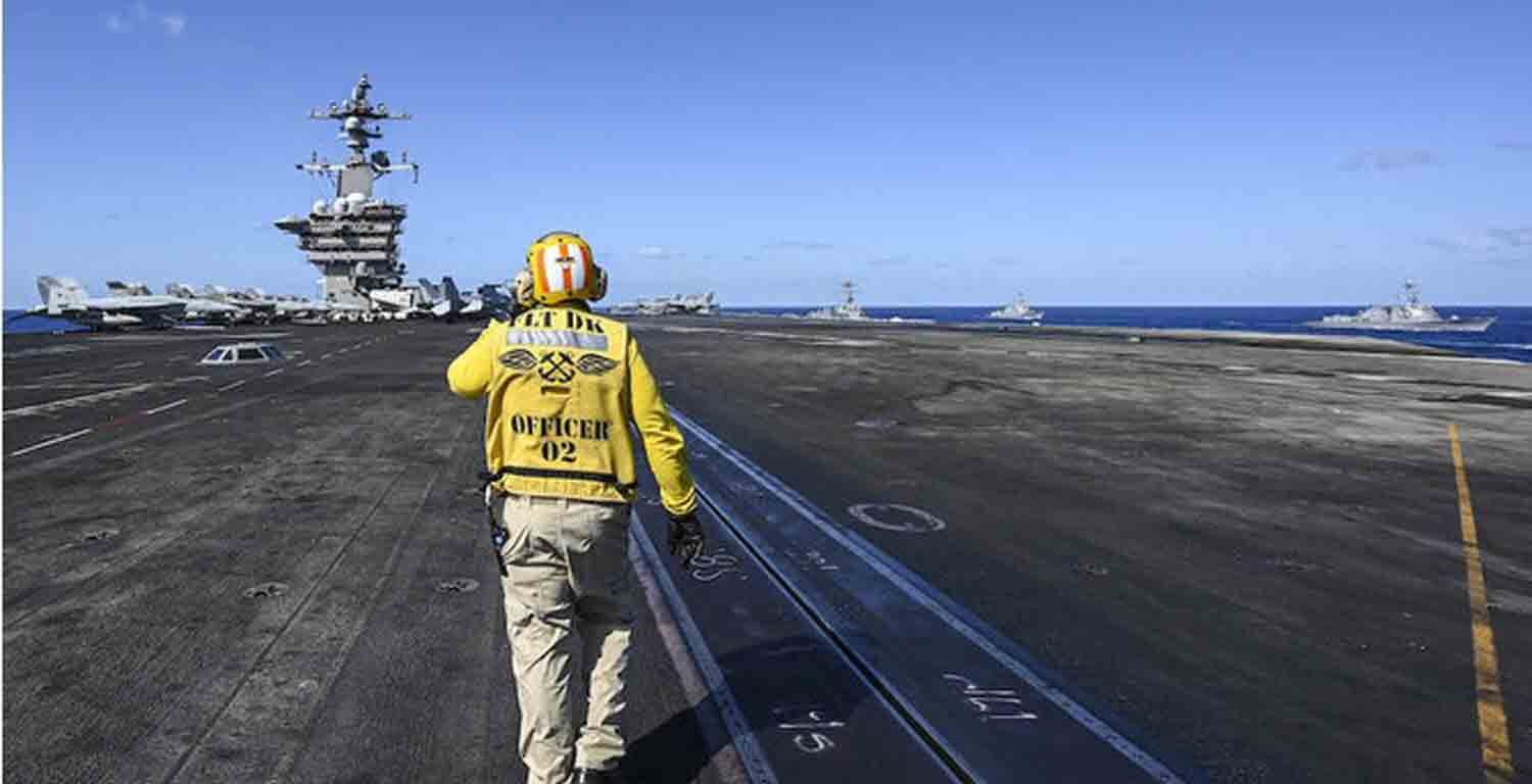 A crew member works on the deck of the USS Carl Vinson aircraft carrier during an earlier maritime exercise in the Philippine Sea.