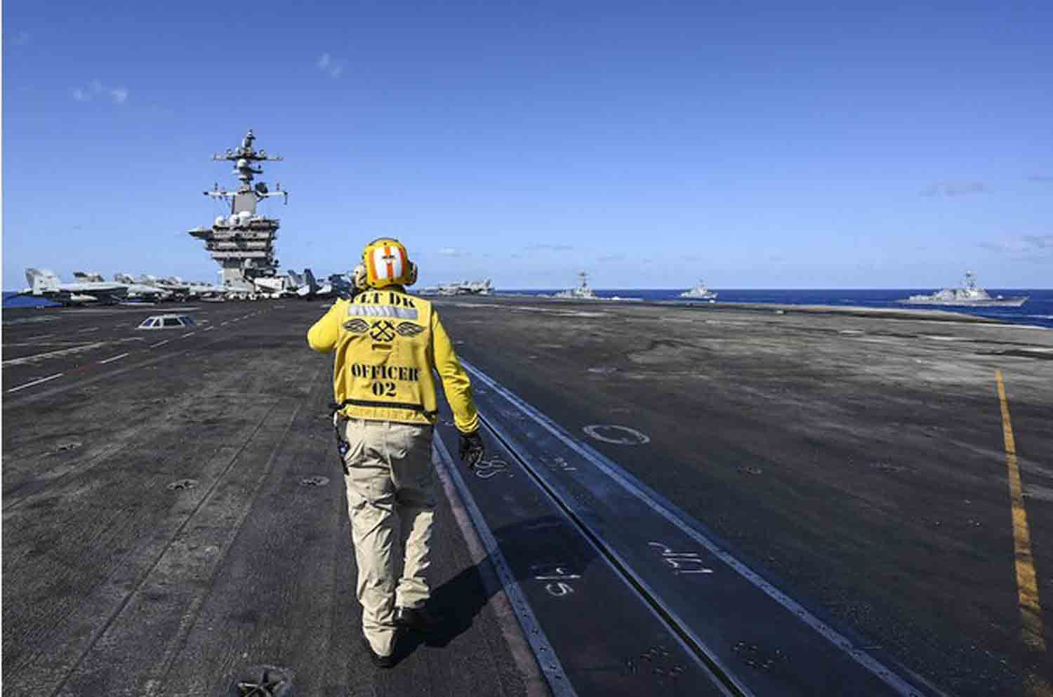 USS-Carl-Vinson-aircraft-carrier A crew member works on the deck of the USS Carl Vinson aircraft carrier during an earlier maritime exercise in the Philippine Sea.