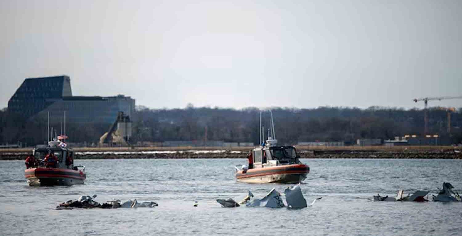 U.S. Coast Guard, along with other search and rescue teams, operate near debris at the crash site in the Potomac River in a location given as Washington, in the aftermath of the collision of American Eagle flight 5342 and a Black Hawk helicopter that crashed into the Potomac River, U.S.