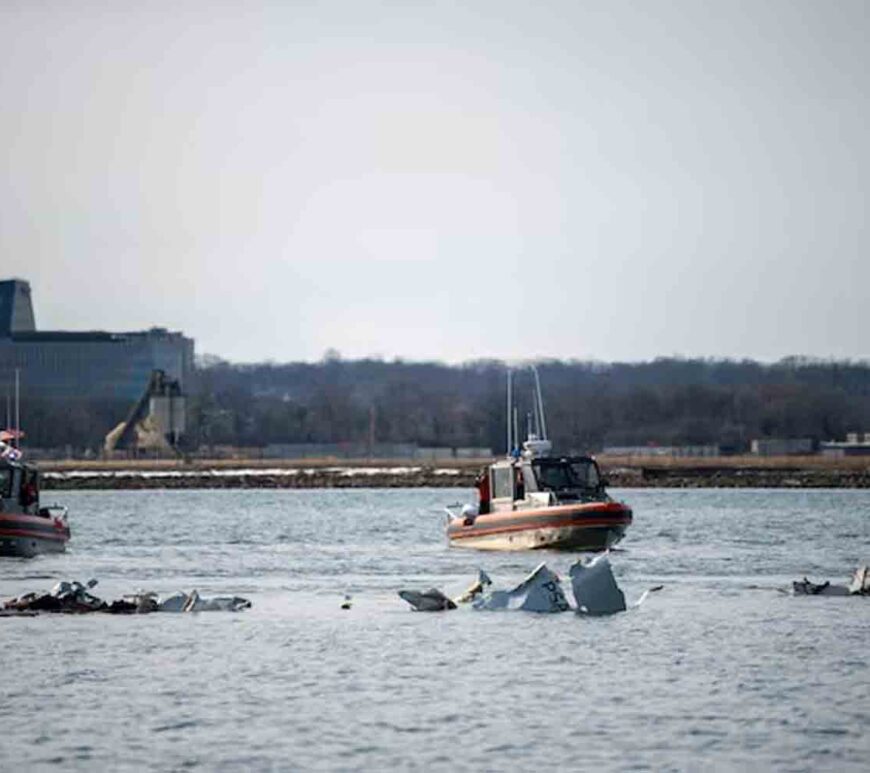 U.S. Coast Guard, along with other search and rescue teams, operate near debris at the crash site in the Potomac River in a location given as Washington, in the aftermath of the collision of American Eagle flight 5342 and a Black Hawk helicopter that crashed into the Potomac River, U.S.