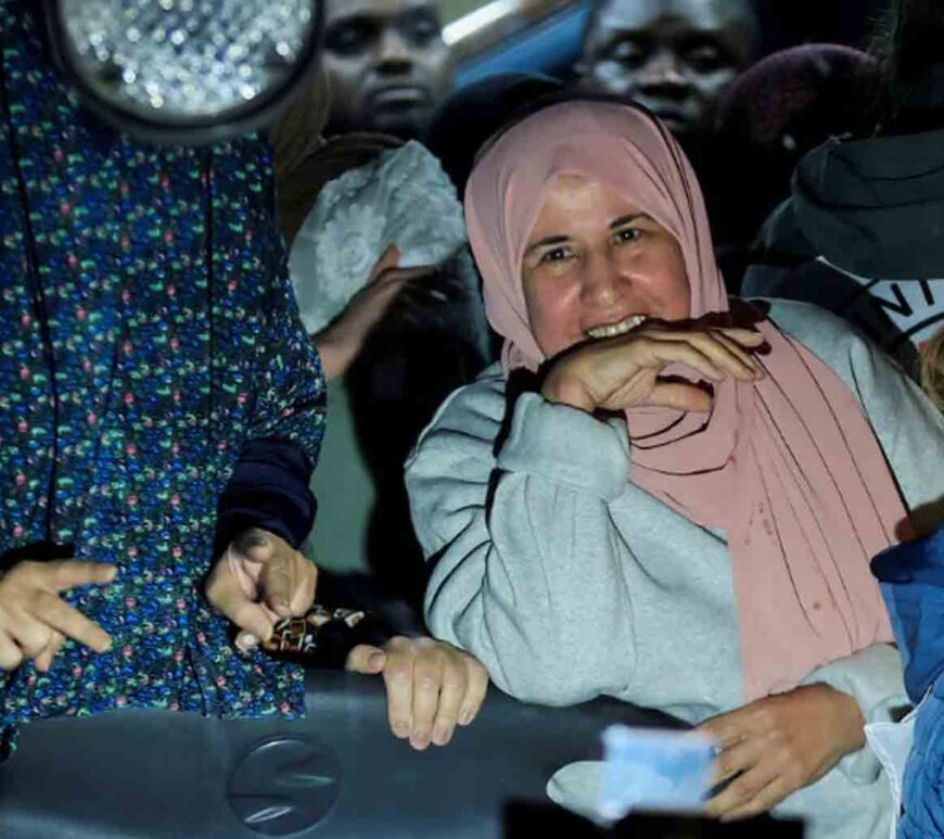 A freed Palestinian prisoner reacts from inside a bus that arrived with them after their release from an Israeli jail as part of a hostages-prisoners swap and a ceasefire deal in Gaza between Hamas and Israel, in Ramallah, in the Israeli-occupied West Bank.