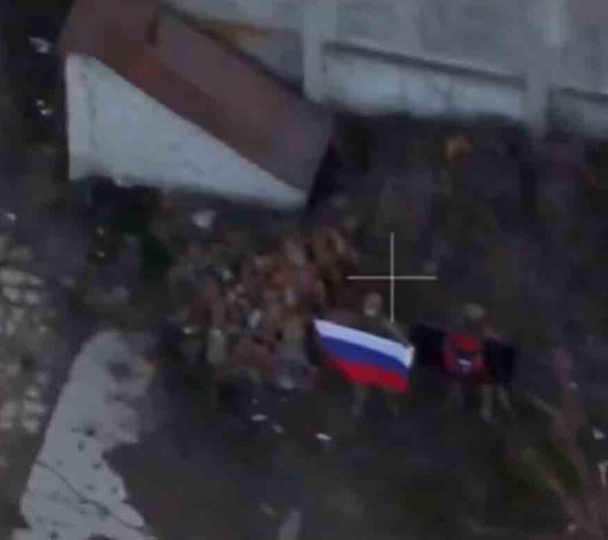 A soldier holds up a Russian flag in Kurakhove, Donetsk Region, Ukraine in this screen grab taken from a social media video released on January 5, 2025.