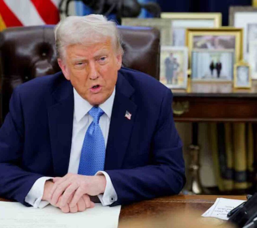 U.S. President Donald Trump looks on as he signs an executive order in the Oval Office at the White House in Washington,.