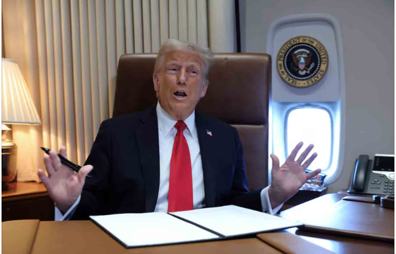 Donald-Trump-speaks-to-reporters U.S. President Donald Trump speaks to reporters before signing a proclamation renaming the Gulf of Mexico to the Gulf of America, while flying over the gulf aboard Air Force One en route to New Orleans to attend the Super Bowl.