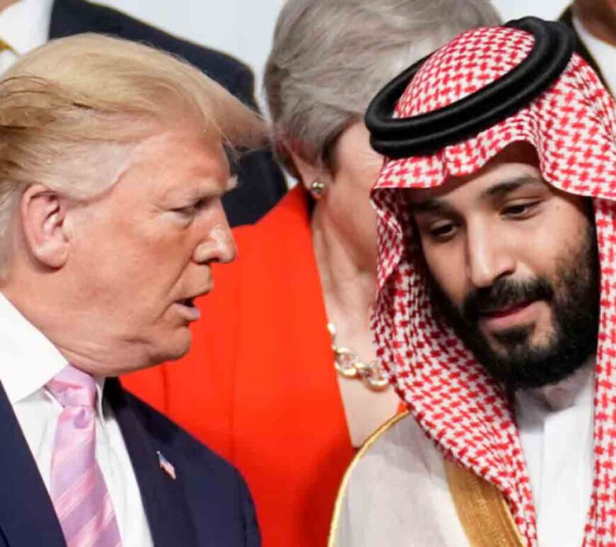 U.S. President Donald Trump speaks with Saudi Arabia's Crown Prince Mohammed bin Salman during family photo session with other leaders and attendees at the G20 leaders summit in Osaka, Japan.