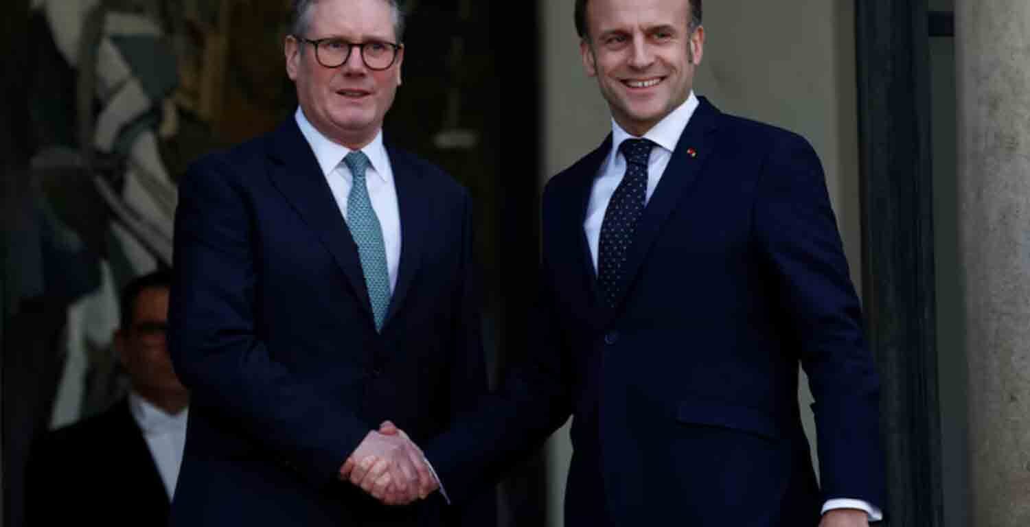 French President Emmanuel Macron welcomes Britain's Prime Minister Keir Starmer as he arrives for a meeting with European leaders on Ukraine and European security at the Elysee Palace in Paris, France.