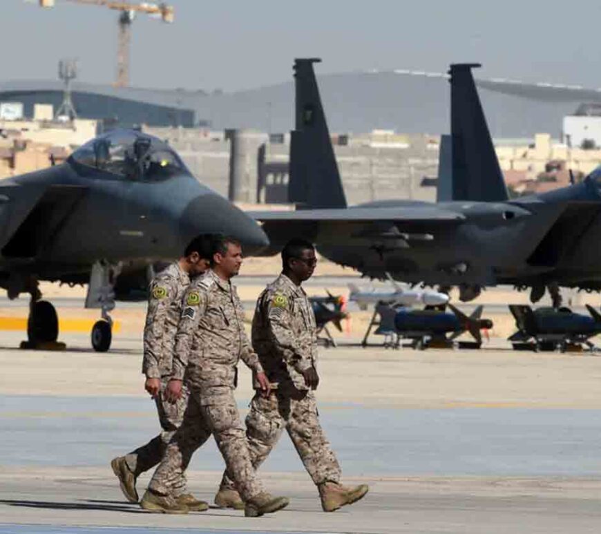 Saudi army officers walk past F-15 fighter jets, GBU bombs and missiles displayed during a ceremony marking the 50th anniversary of the creation of the King Faisal Air Academy at King Salman airbase in Riyadh.