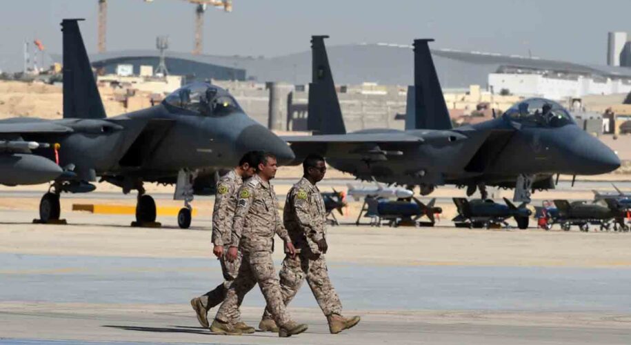 Saudi army officers walk past F-15 fighter jets, GBU bombs and missiles displayed during a ceremony marking the 50th anniversary of the creation of the King Faisal Air Academy at King Salman airbase in Riyadh.