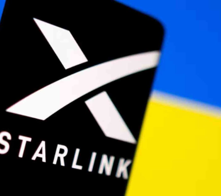 Starlink logo is seen on a smartphone in front of displayed Ukrainian flag in this illustration.