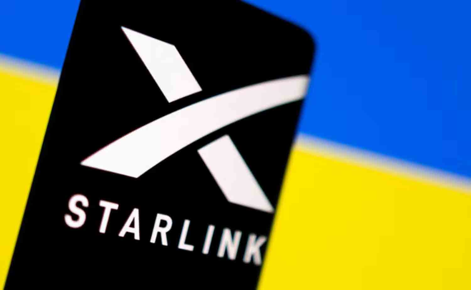 Starlink Starlink logo is seen on a smartphone in front of displayed Ukrainian flag in this illustration.