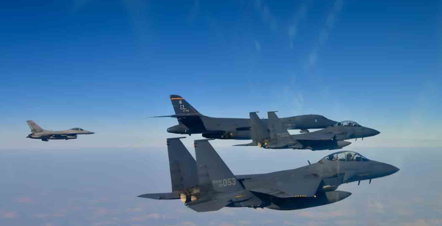 A U.S. Air Force B-1B bomber, top second from left, and South Korean Air Force F-15K fighter jets, right bottom, conduct a joint aerial drill over the Korean Peninsula on Thursday.