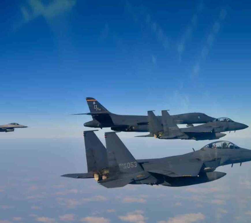 A U.S. Air Force B-1B bomber, top second from left, and South Korean Air Force F-15K fighter jets, right bottom, conduct a joint aerial drill over the Korean Peninsula on Thursday.