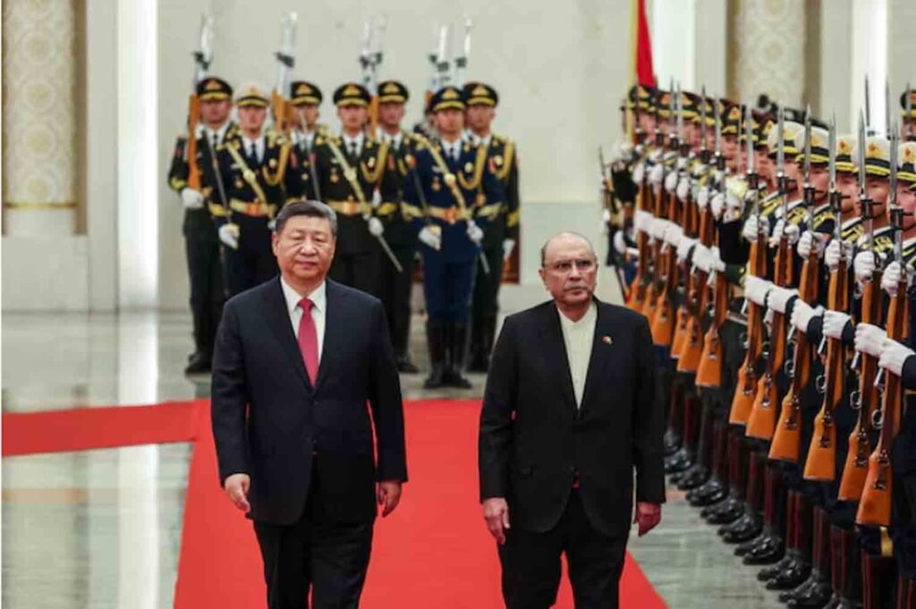Chinese President Xi Jinping and Pakistani President Asif Ali Zardari walk past the honor guards during the welcome ceremony at the Great Hall of the People in Beijing, China.