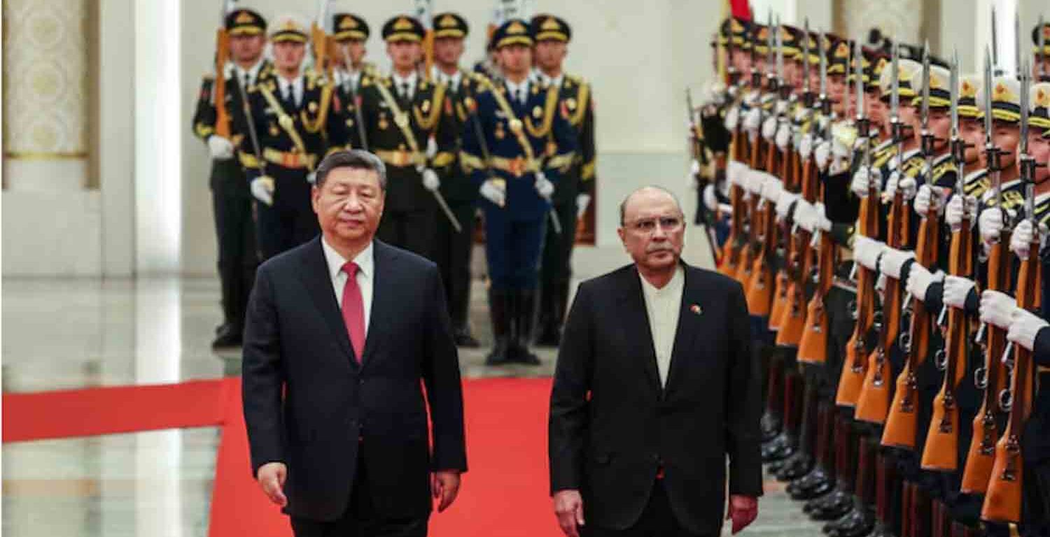 Chinese President Xi Jinping and Pakistani President Asif Ali Zardari walk past the honor guards during the welcome ceremony at the Great Hall of the People in Beijing, China.