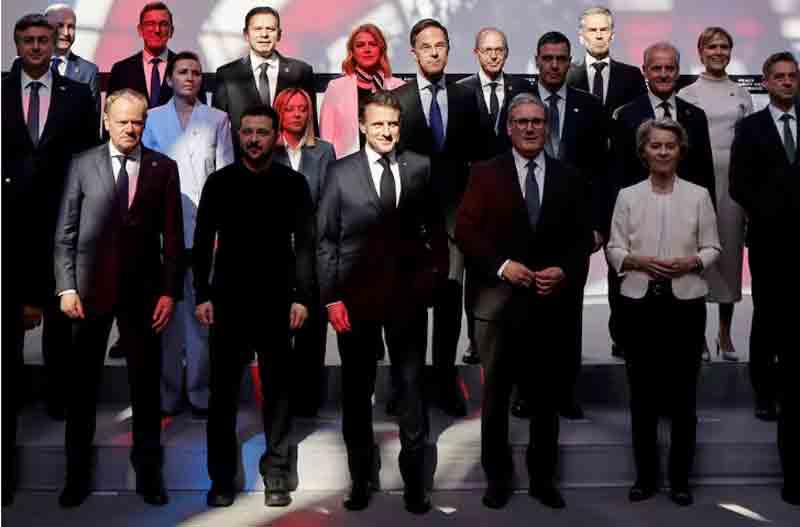 Poland's Prime Minister Donald Tusk, Ukraine's President Volodymyr Zelensky, France's President Emmanuel Macron, Britain's Prime Minister Keir Starmer and European Commission President Ursula Von der Leyen pose for a family picture during a meeting as part of a summit for 