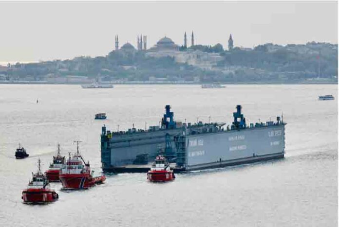 A Russian floating dock is towed by tugboats through Bosphorus to the Black Sea.