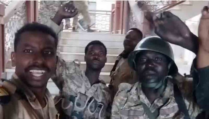 Sudanese army members film themselves inside the presidential palace, after, according to the Sudanese army, they took the control of the presidential palace, in Khartoum, Sudan.