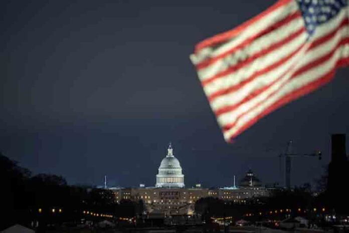 The U.S. flag flutters in front of the U.S. Capitol building in Washington, U.S.