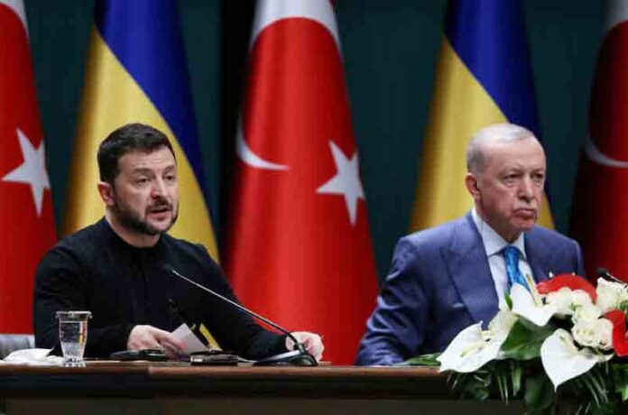 Ukrainian President Volodymyr Zelenskiy speaks as Turkey's President Tayyip Erdogan listens during a joint press conference in Ankara, Turkey.
