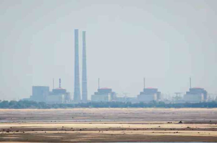 A view shows Zaporizhzhia Nuclear Power Plant from the bank of Kakhovka Reservoir near the town of Nikopol after the Nova Kakhovka dam breached, amid Russia's attack on Ukraine, in Dnipropetrovsk region, Ukraine.