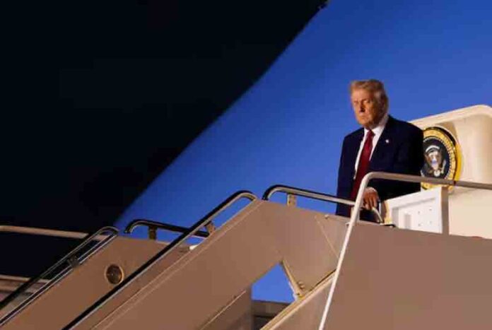 U.S. President Donald Trump disembarks Air Force One as he arrives at Palm Beach International Airport in West Palm Beach, Florida, U.S.