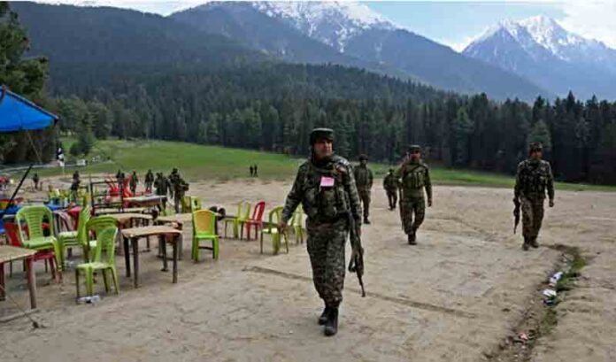 Security personnel inspect the site in the aftermath of an attack as food stall chairs lie empty in Pahalgam, about 90km (55 miles) from Srinagar.