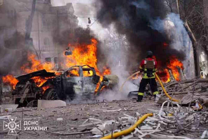 Firefighters work at the site of a Russian missile strike, amid Russia's attack on Ukraine, in central Sumy, Ukraine.