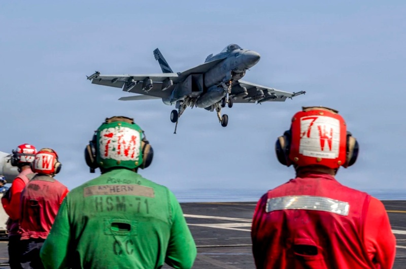 An F/A-18E Super Hornet landing on the flight deck of the USS Abraham Lincoln aircraft carrier in support of Operation Epic Fury