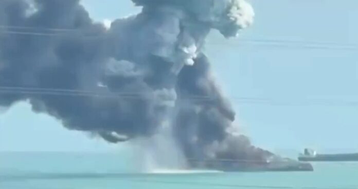 Iranian ship engulfed in flames near Bandar Abbas following strikes linked to the ongoing U.S.–Israeli campaign targeting Iranian naval assets.