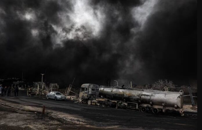 Smoke rises after a reported strike on Shahran fuel tanks in Tehran, Iran Smoke rises after a reported strike on Shahran fuel tanks in Tehran, Iran