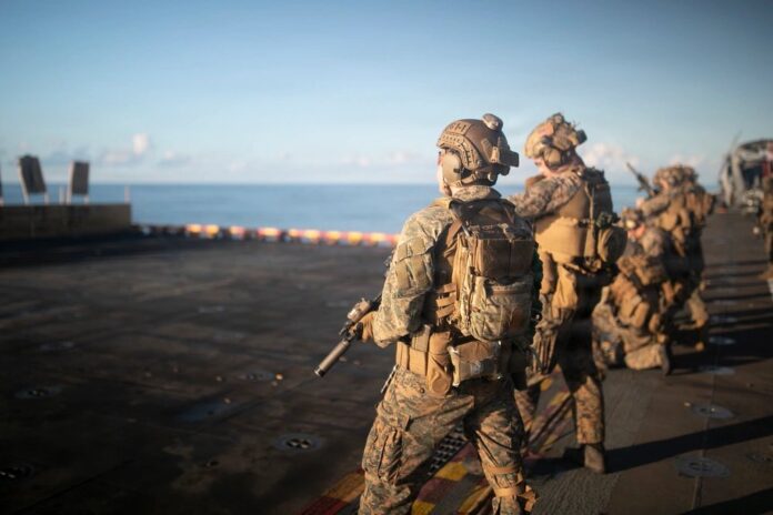 U.S. Marines, assigned to the 31st Marine Expeditionary Unit (31st MEU), conduct a gun shoot onboard the America-class amphibious assault ship USS Tripoli