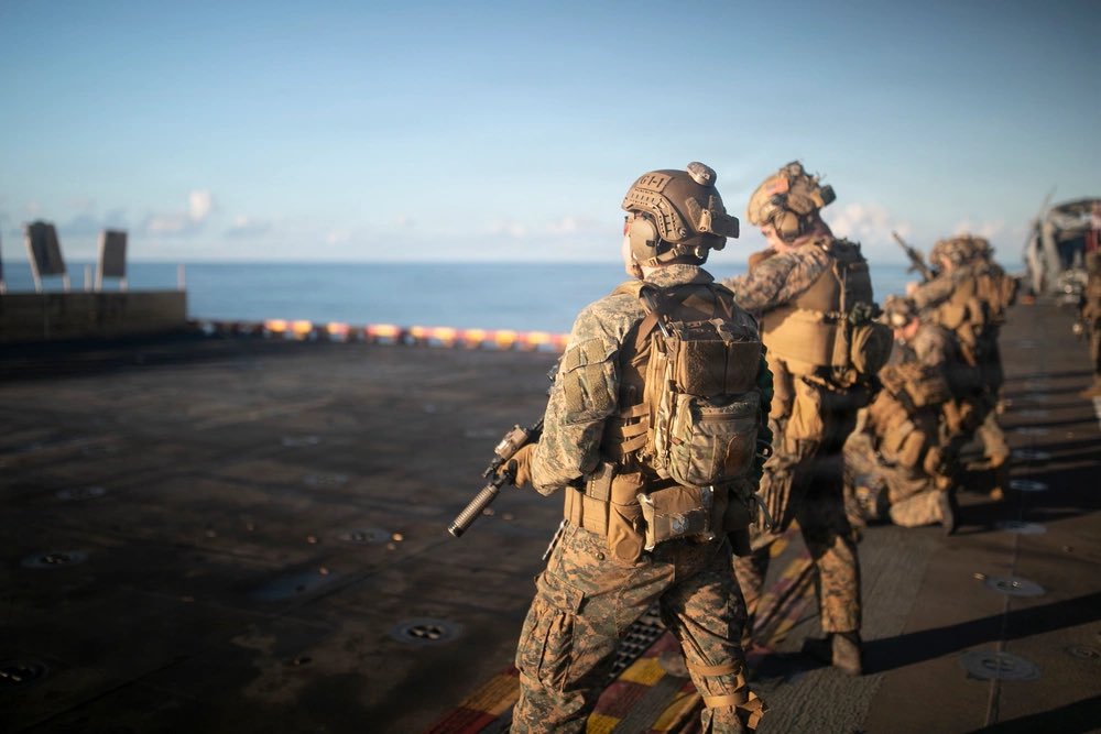 U.S. Marines, assigned to the 31st Marine Expeditionary Unit (31st MEU), conduct a gun shoot onboard the America-class amphibious assault ship USS Tripoli