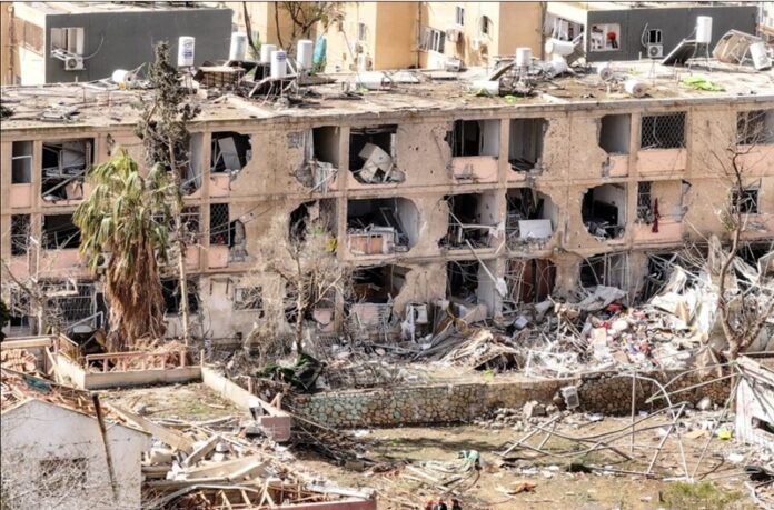 damage in a residential neighbourhood, following a night of Iranian missile strikes A drone view shows a damage in a residential neighbourhood, following a night of Iranian missile strikes which injured dozens of Israelis, amid the U.S.-Israel conflict with Iran, in Dimona, southern Israel March 22, 2026.