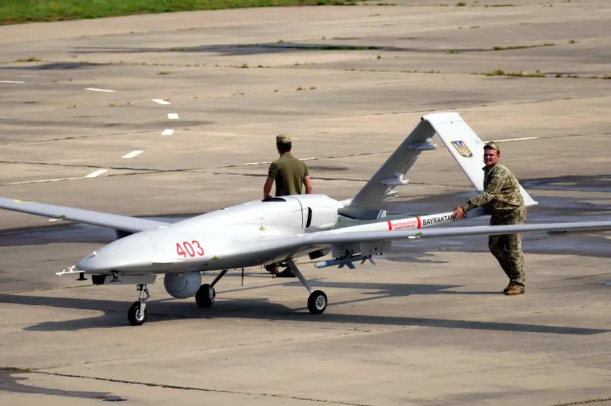 Ukrainian servicemen push a Bayraktar TB2 UCAV at the Kulbakyne aerodrome during the Exercise Sea Breeze 2021.