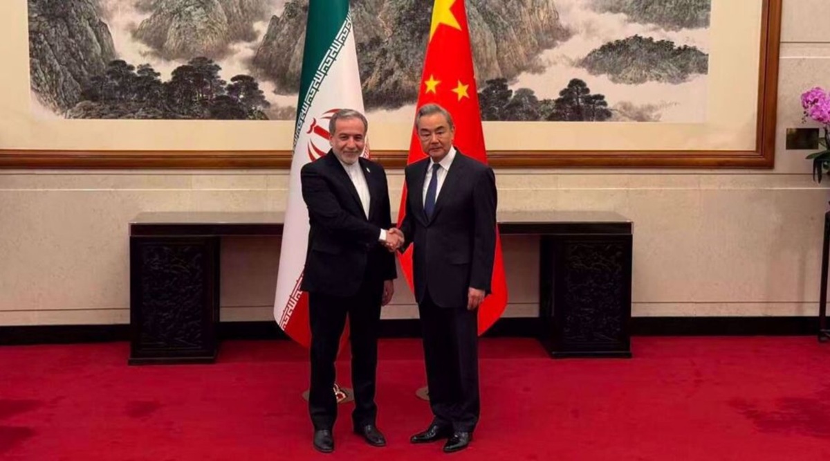 Iran’s Foreign Minister Abbas Araghchi (L) shakes hand with his Chinese counterpart, Wang Yi, in Beijing, China, May 5, 2026.
