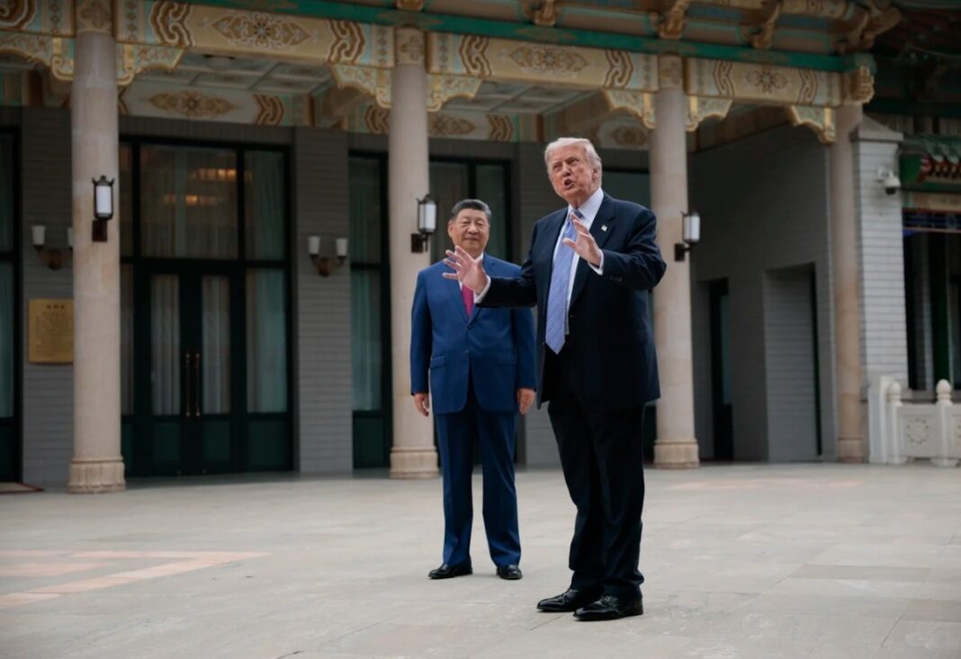 U.S. President Donald Trump gestures as he speaks next to Chinese President Xi Jinping at the Zhongnanhai Garden on Friday. Issues including Taiwan, Iran and others were dicussed.