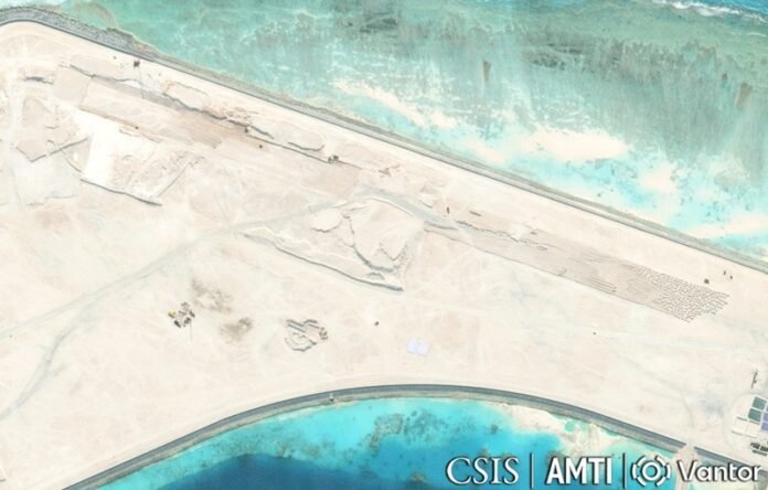 Satellite image showing early runway construction and land reclamation at China's Antelope Reef artificial island in the disputed Paracel Islands of the South China Sea.