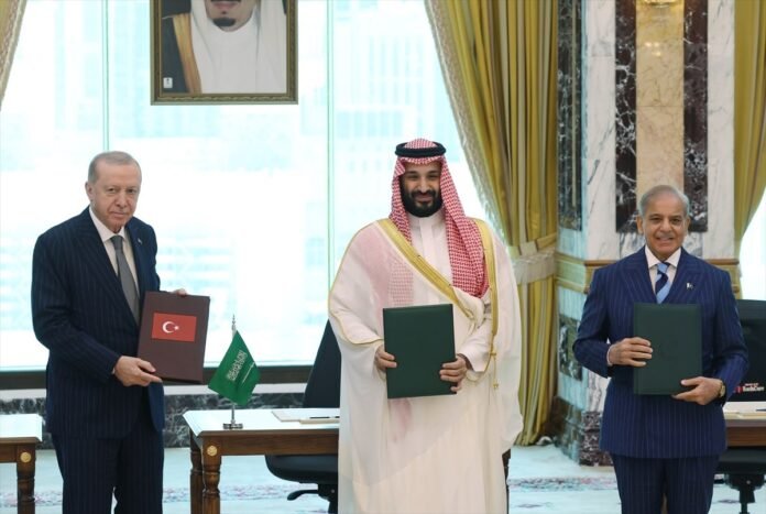 Turkey, Saudi Arabia, and Pakistan signed a trilateral defense agreement in Mecca. Erdogan, Mohammed bin Salman, and Shehbaz Sharif attended.